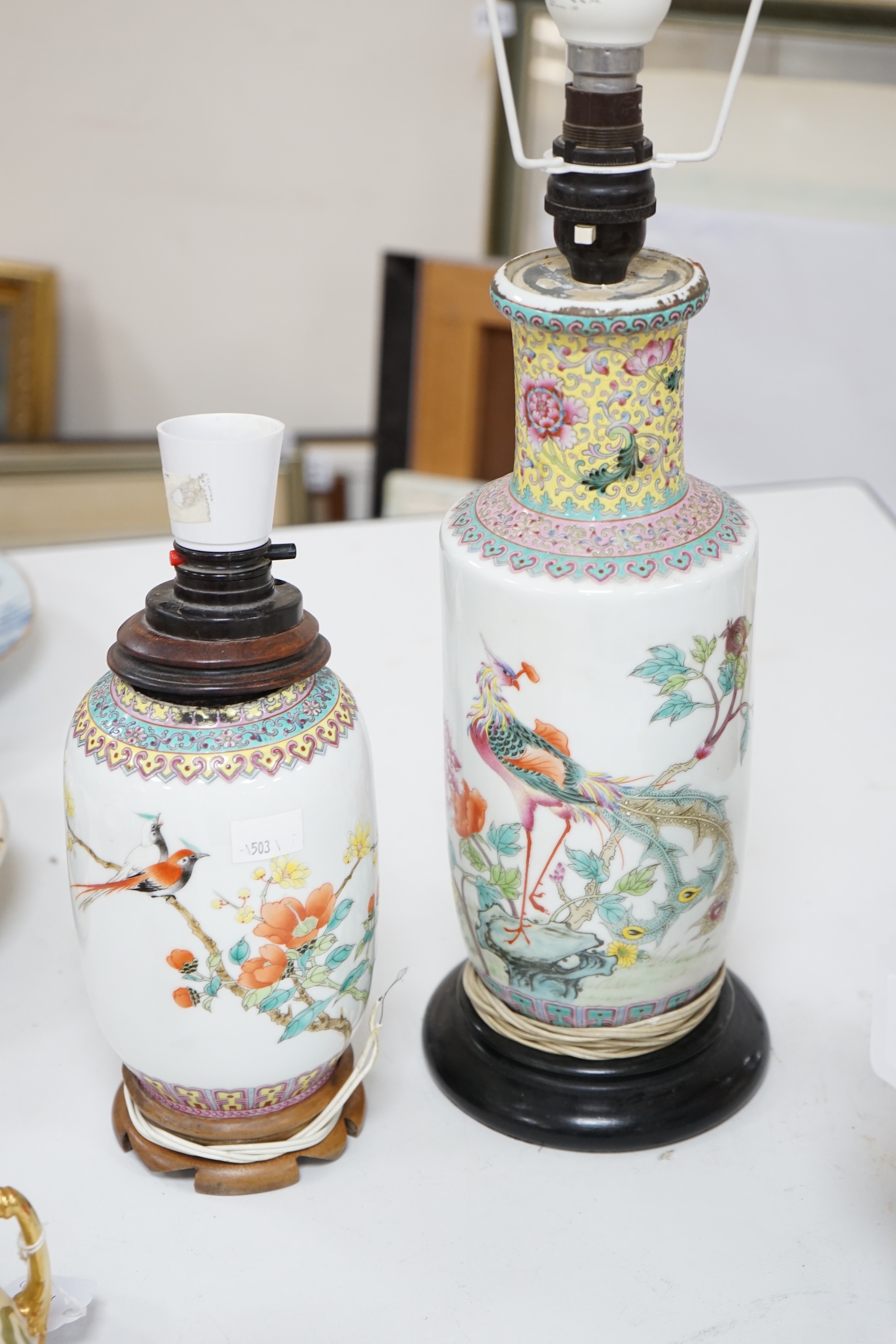 Two early 20th century Chinese famille rose lamps and a large teapot. Condition - fair